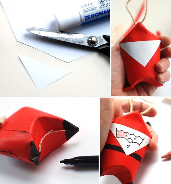 Bạn cắt một mảnh giấy trắng theo hình tam giác rồi dùng bút dạ vẽ khuôn mặt ông già Noel.
